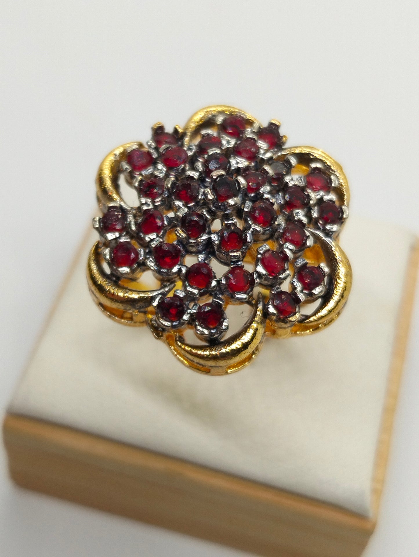 Red stone adjustable ring in casting
