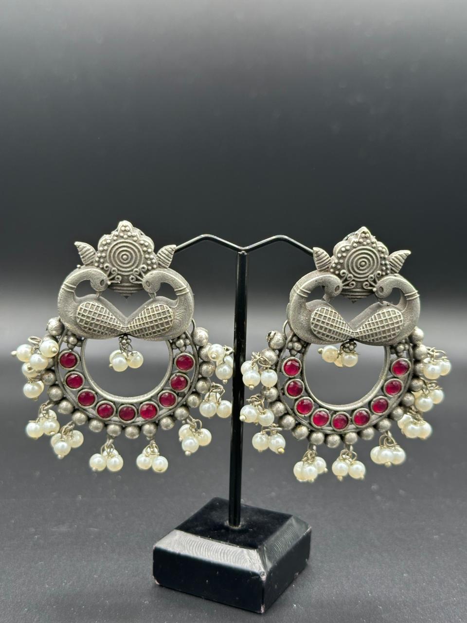 The Peacock Dance | Enameled Red Stone Oxidized Peacock Jhumka's