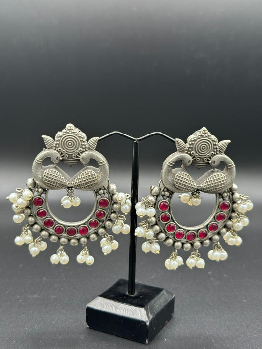 The Peacock Dance | Enameled Red Stone Oxidized Peacock Jhumka's