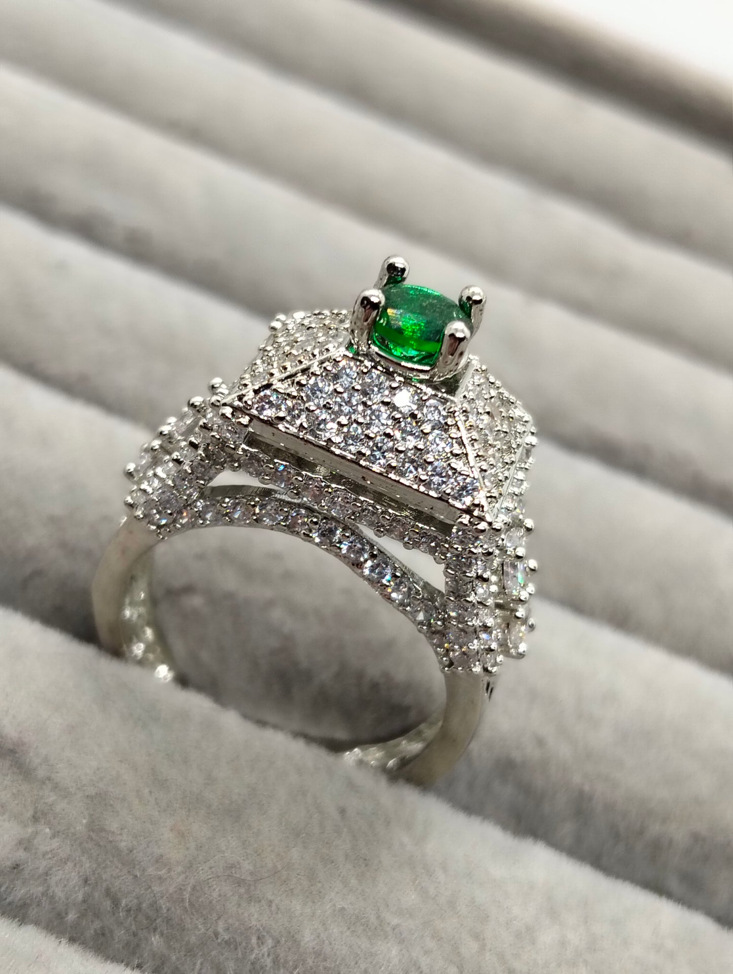 Green stone adjustable tower ring in one carat silver rhodium plated