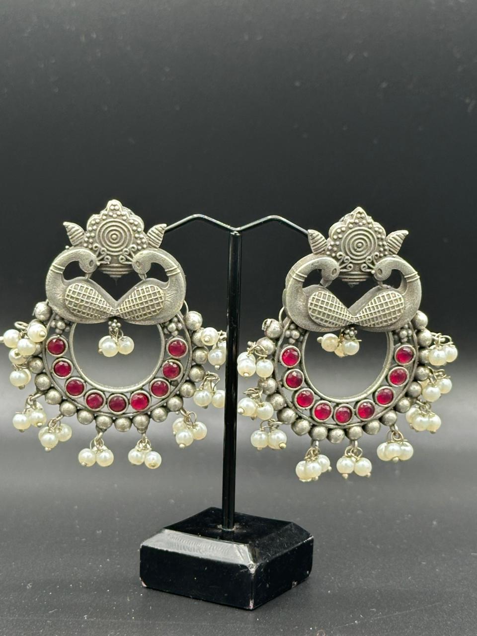 The Peacock Dance | Enameled Red Stone Oxidized Peacock Jhumka's