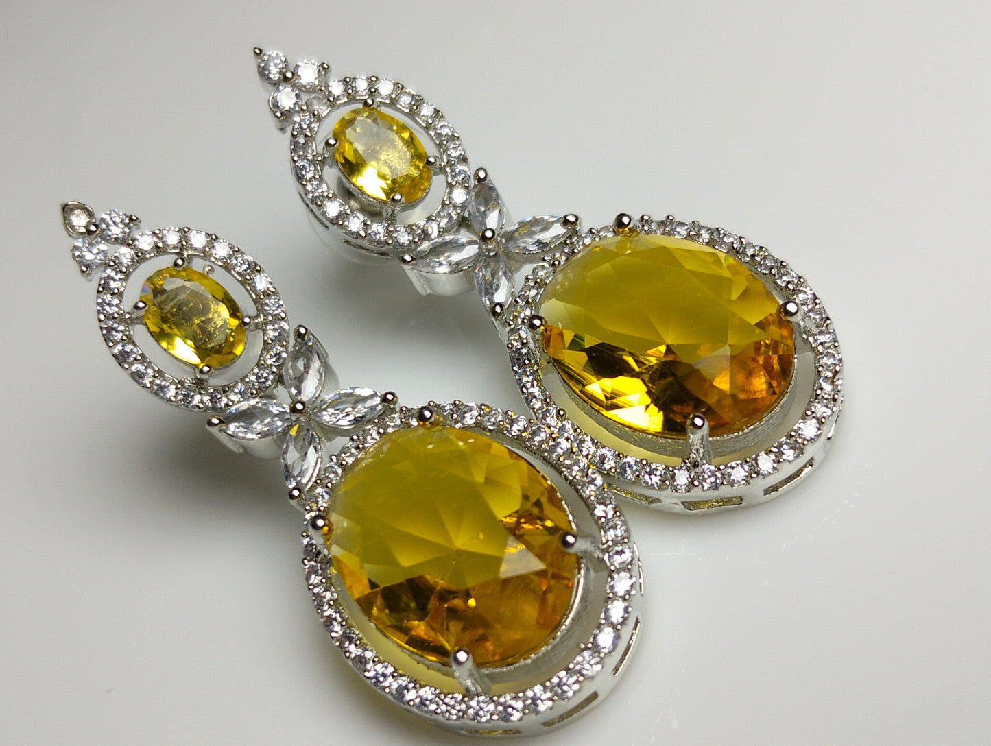Champagne stone Ad earing silver rhodium plated