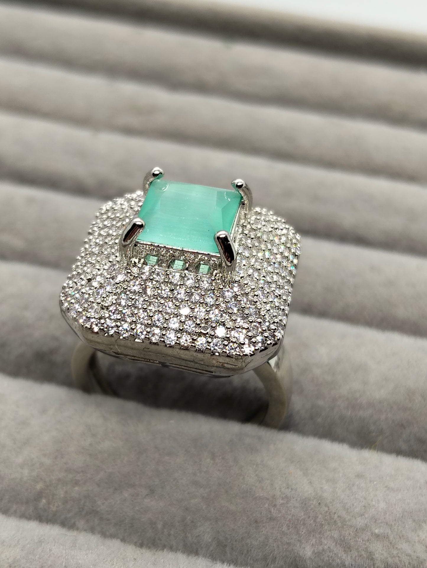 One carat silver rhodium plated ring in mint green stone adjustable