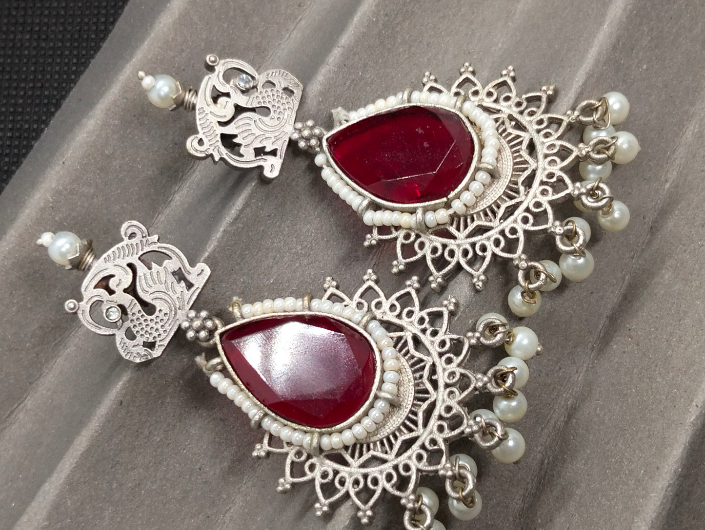 Silver ethnic Oxidized jhumka's in red stone