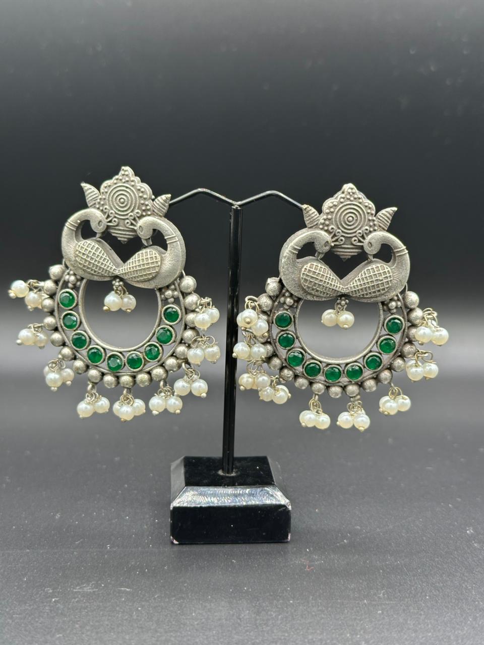 The Peacock Dance | Enameled Green Stone Oxidized Peacock Jhumka's