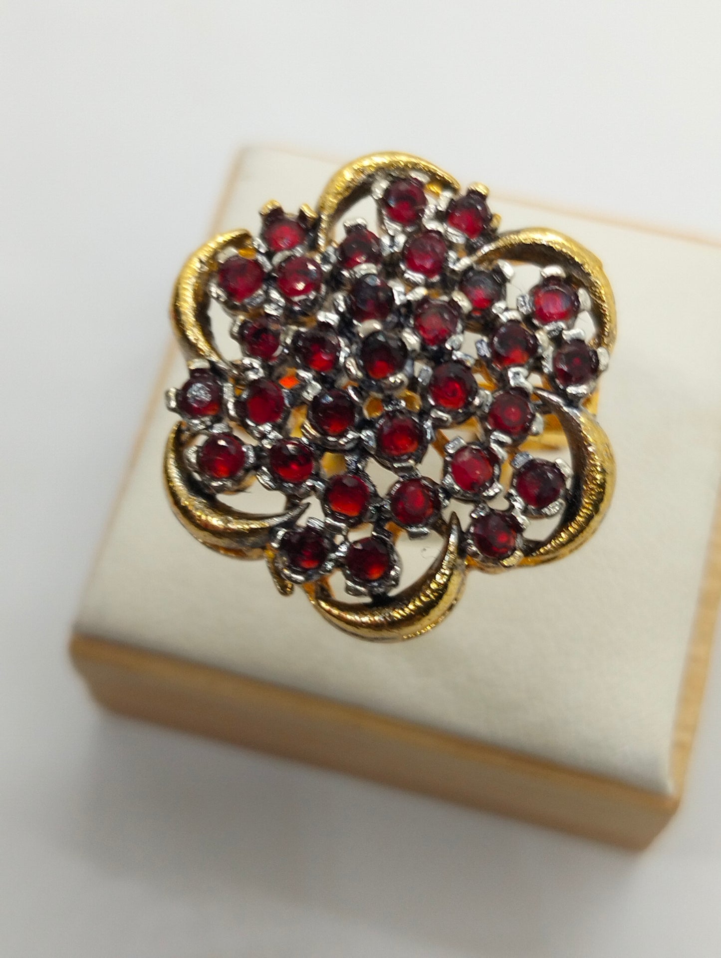 Red stone adjustable ring in casting