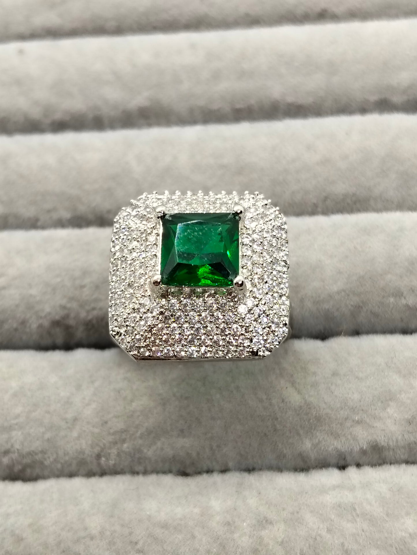 One carat silver rhodium plated ring in green stone